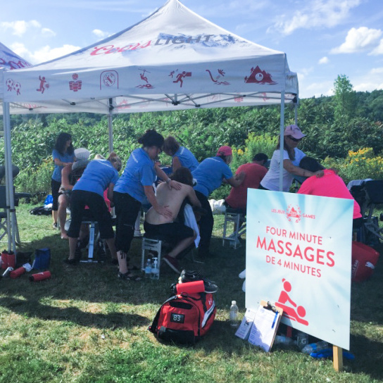 People getting a mobile massage at a golfing event